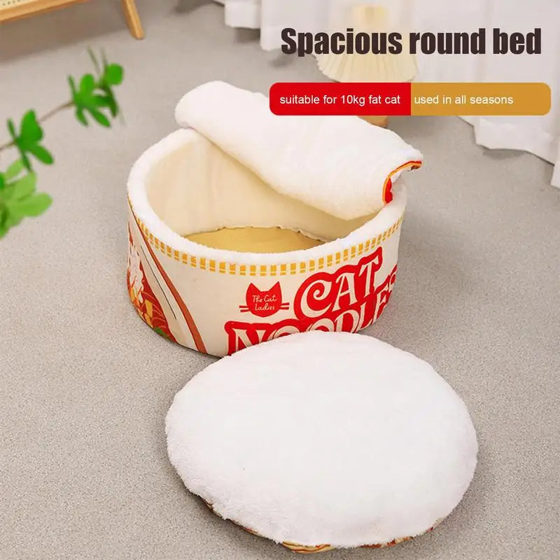 The KittyNook Cat Co. Cute Ramen Cat Bed offers orthopedic support and a fluffy cushion, shown on a carpeted floor.