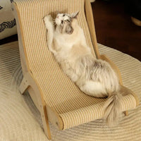 Thumbnail for A fluffy cat lounges and scratches on the KittyNook Cat Co. Cat Sisal Wooden Chair in a warm, inviting room.