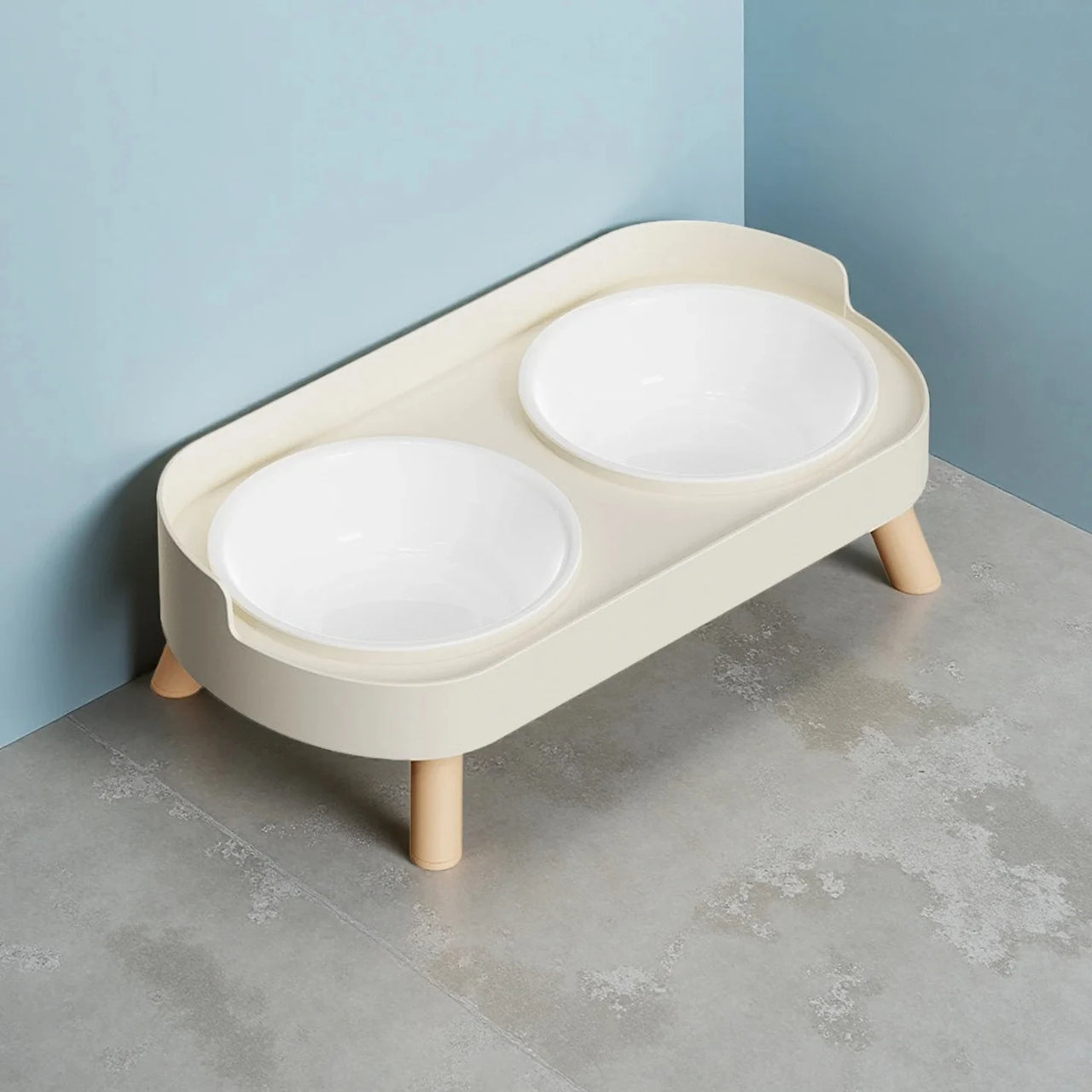 The Dopamine DuoLift Colorful Cat Feeder by KittyNook Cat Co. is a stylish raised cat bowl with two white bowls.