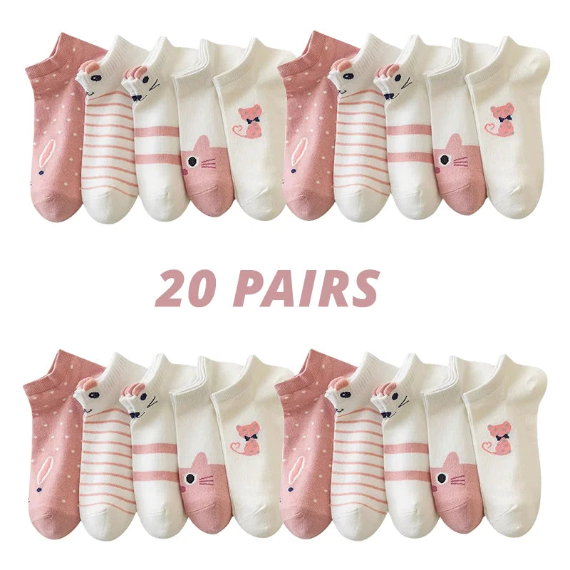 Twenty pairs of Sweet Kitty Pink Short Tube Socks by KittyNook Cat Co. in stripes, polka dots, and cute faces.