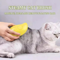 Thumbnail for A person grooms a gray cat with the SteamSoft Gentle Cat Brush by KittyNook Cat Co.—massage, clean, and reduce shedding.