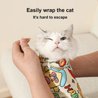 Thumbnail for The KittyNook Cat Co. Cat Burrito Grooming Wrap snuggly swaddles cats for gentle, safe ear cleaning.