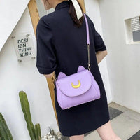 Thumbnail for A Woman Carrying the Luna Crescent Hand Bag in Purple