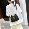 Load image into Gallery viewer, A Woman Carrying the Luna Crescent Hand Bag in Black
