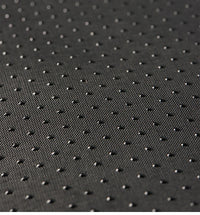 Thumbnail for Close-up of the black textured surface of KittyNook Cat Co.'s Shark-Shaped Cat Cave Bed, with raised grid dots.