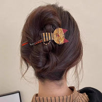 Thumbnail for Woman with brown hair in a twist, secured by The Acrylic Cat Hairpin from KittyNook Cat Co.—great cat lover gift.
