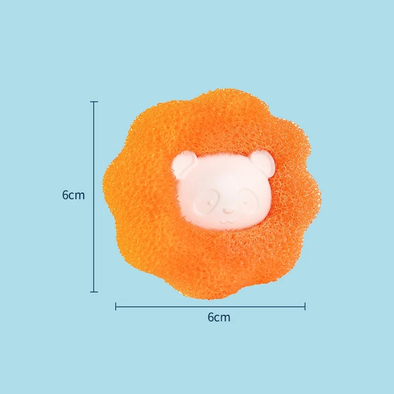 The Laundry Pet Hair Filter by KittyNook Cat Co., 6x6cm orange sponge with white bear face, shown on light blue.