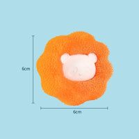 Thumbnail for The Laundry Pet Hair Filter by KittyNook Cat Co., 6x6cm orange sponge with white bear face, shown on light blue.