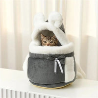 Thumbnail for A tabby cat sits in The Stylish Pet Travel Bag by KittyNook Cat Co., a gray bunny-shaped plush pet carrier.