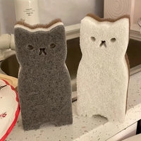 Thumbnail for KittyNook Cat Co.'s Adorable Cat-Shaped Dish Sponge Set – 4 pieces stands upright on the kitchen counter by the sink.