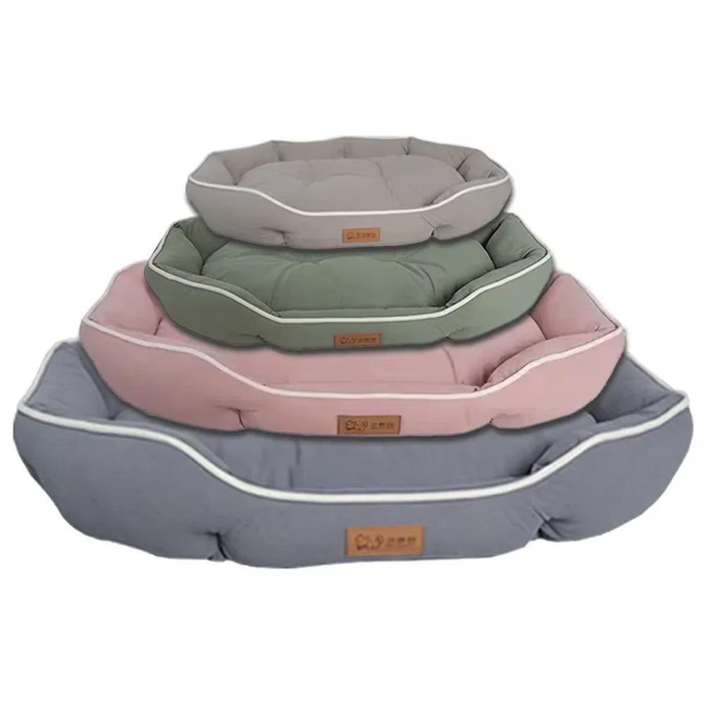 Four stacked KittyNook Cat Co. Comfy Cat Sofa Beds in gray, green, pink, and light gray, each with a brown label.