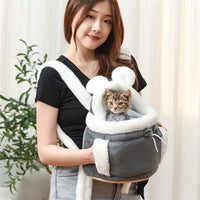 Thumbnail for A woman holds a kitten in The Stylish Pet Travel Bag by KittyNook Cat Co., perfect for hands-free pet travel.