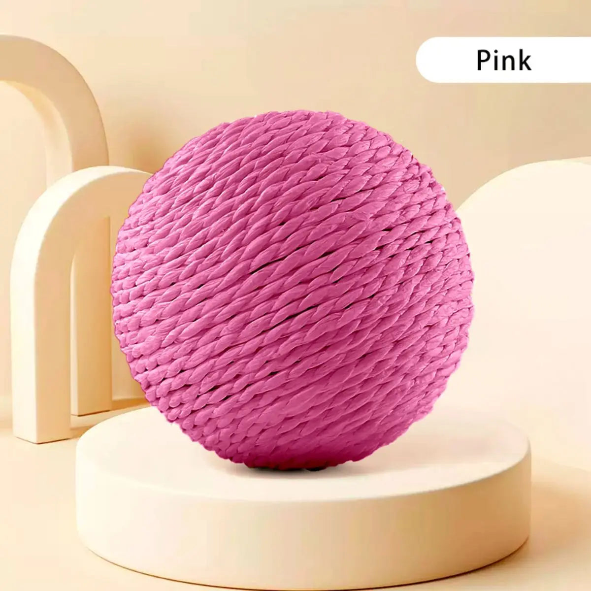 The Premium Sisal Kitten Scratching Ball by KittyNook Cat Co. is shown on a round platform against a beige background.