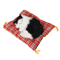 Thumbnail for KittyNook Cat Co.’s Sleepy Kitten Plush Decoration is a cute home accessory, curled up on a red plaid cushion.