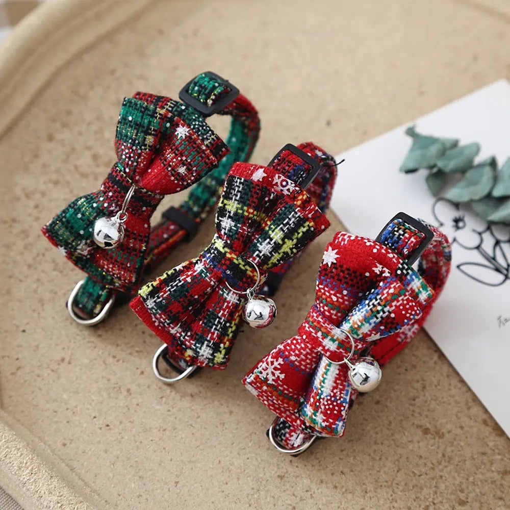 KittyNook Cat Co.’s Christmas Mini Collar for Cats features plaid bowties and bells in red, green, and multicolor patterns.