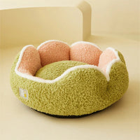 Thumbnail for The KittyNook Cat Co. Warm & Soft Cat Sleeping Pod, with green sides and pink flower interior, sits on a beige background.