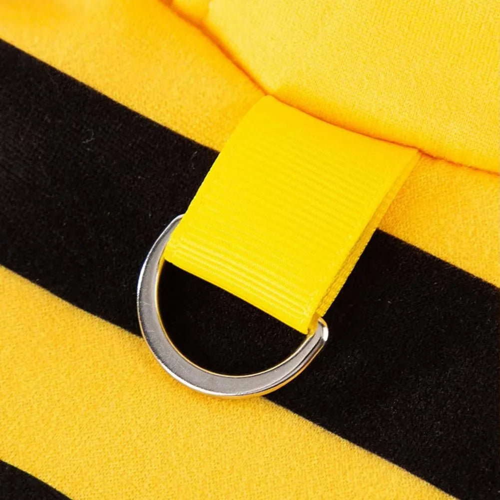 Close-up of a silver D-ring on yellow fabric, part of the KittyNook Cat Co. Cute Bee Costume Cats with black stripes.